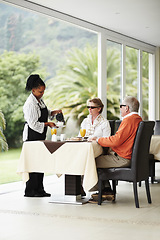 Image showing Waitress, coffee and senior couple in restaurant patio on romantic date together at table. Old man, woman and server with drink and breakfast service in luxury hospitality, hotel and relax on terrace