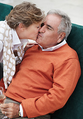 Image showing Love, kiss and senior couple in a backyard with champagne for retirement, anniversary or celebration. Trust, gratitude and old people embrace in a yard with care, trust and bond, fun and romance