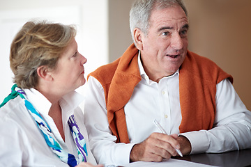 Image showing Sign in, hotel and senior couple by reception to check in desk for love, anniversary and relax. Retirement, hospitality resort and elderly man and woman with concierge for travel, holiday or vacation