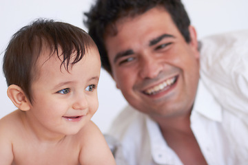Image showing Happy man, baby and together with smile for development, growth and health in wellness. Father, son and excited with hope with future in family home, quality time and bonding with love in Germany