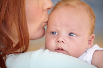 Image showing Kiss, baby and portrait of newborn with mother in home bonding together with affection. Calm, face and mom carrying infant child in arms to relax in house with love, care and support with mommy