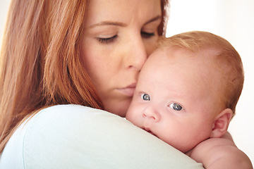 Image showing Kiss, baby and portrait with mother holding newborn in home for bonding together. Infant, face and mom carrying infant child in arms to relax in house with love, care and support with mommy