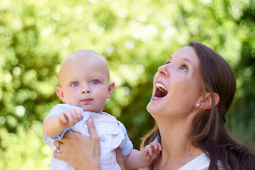 Image showing Woman, baby and smile outdoor in garden for care, love or bonding on holiday, summer sunshine or thinking. Happy mother, infant child and comic laugh in backyard, park or woods with family in spring