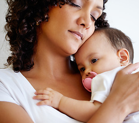 Image showing Cuddling, hug and a mother and child sleeping with love, care and relax together in a house. Family, peace and a mom with a newborn, baby or infant kid with affection in motherhood for rest and calm