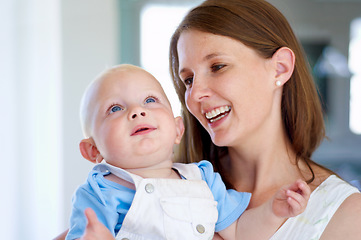 Image showing Happy, hug or mother with newborn or baby for love or bond together to nurture child development. Smile, face or single parent mom with infant for trust, growth or safety in family house to relax