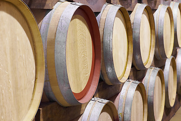 Image showing Background, wine production and oak barrel in brewery for beer, alcohol manufacturing and whiskey fermentation. Closeup, wood cask and liquor storage container in winery, factory and distillery vault