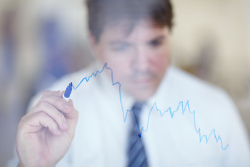 Image showing Glass wall, growth and businessman drawing a chart in the office for company development planning. Board, writing and professional male executive ceo or boss working on graph strategy in workplace.