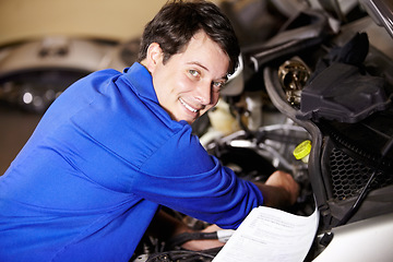 Image showing Portrait, happy man and mechanic with document on engine of car, repair or maintenance. Smile, face and technician with paperwork on motor vehicle, auto service or workshop, garage or small business