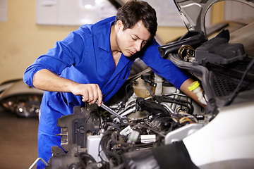 Image showing Wrench, serious man and mechanic check engine of car, repair or maintenance. Spanner tools, technician and person on motor vehicle, fix transportation or inspection at auto service workshop or garage