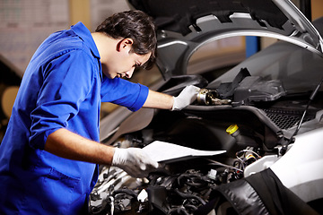 Image showing Document, man and technician check engine of car, repair and maintenance. Checklist, mechanic and serious person on motor vehicle hood, inspection list or fixing transportation at auto service garage