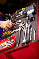 Image showing Hands, mechanic and toolbox for auto service at workshop, small business or garage. Closeup, man and equipment, toolkit or metal tools of technician, engineer or expert for repair, maintenance or fix