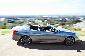 Image showing Blur, smile or man drive sports car on road, travel or journey outdoor on trip. Happy person with sunglasses in motor vehicle, speed or fast on street for freedom in luxury convertible transportation