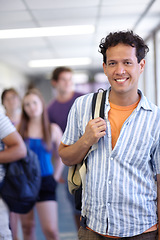 Image showing Student, university and backpack in corridor, smile and ready for class, man and happy. Portrait, education and knowledge for learning, study and college for career, campus and youth scholarship