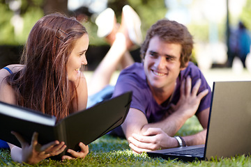 Image showing Students, outdoor and laptop on grass, university and smile for workbook, learning and technology. College, notebook and teenager for education, career or studying together for exam, man and woman