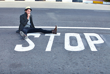 Image showing Man, asphalt and stop or sign on road, danger and sitting by symbol, bad habits and addiction to drugs. Male person, nicotine and danger or risk, street and warning of cigarette, awareness and quit