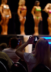 Image showing Audience, woman and fitness of bodybuilder or beauty pageant for photography, judge or competition. Female person for photograph, picture or capture of professional models in bikini or lingerie