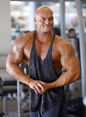 Image showing Body builder, flex and man in a gym with power, weightlifting and strength at a sport club. Muscle, strain and strong male athlete with training for bodybuilder fitness and wellness for workout