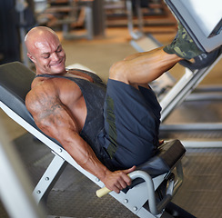 Image showing Leg press, man and fitness at gym with bodybuilder, cardio and muscle power at health club. Wellness, athlete and exercise machine with heavy weight and strain from bodybuilding, sport and workout