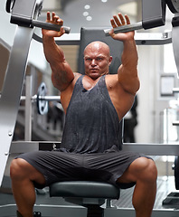 Image showing Man in gym, bodybuilder and muscle with fitness, equipment or gear for muscle training, exercise and strong body. Workout, health and bodybuilding, machine for weights and challenge with power