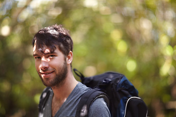 Image showing Portrait, man and smile for hike in forest for fitness, wellness or travel in Sweden. Face, person and backpack with supplies for trip, camping or adventure in nature, fresh air and plants in woods