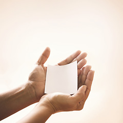 Image showing Hands with blank paper, studio mockup and kindness on notification for support, trust and advice. Care, empathy and help on note with empty space for offer, promo or news on white background.