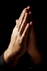 Image showing Prayer, hands and black background for faith, hope and religion or asking for help with mental health or support in studio. Praying emoji, christian person and God, holy spirit or peace in dark room