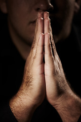 Image showing Praying, hands and person for faith, hope and religion or asking for help with mental health, depression or support in dark room. Prayer emoji for peace, spiritual guidance and God or worship closeup