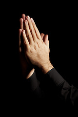 Image showing Prayer, hands and black background for hope, religion and faith or ask for help with worship or spiritual support in studio. Praying emoji, christian person and God, forgive or humanity in dark room