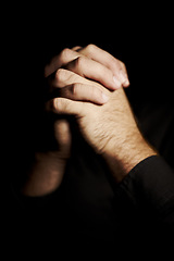Image showing Praying, hands and black background for faith, hope and religion or asking for help with mental health or support in studio. Prayer emoji, christian person and sorry, forgive or humanity in dark room