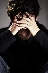 Image showing Man, sad or depression with mental health and thinking about pain, stress or burnout with financial crisis and life. Hands, trauma in studio and bankruptcy with debt and disaster on grey background