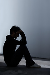 Image showing Man, sad or depression with mental health and silhouette, stress or burnout with financial or life crisis. Emotional, thinking about pain and trauma, bankruptcy or debt with anxiety and psychology