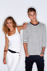 Image showing Fashion, serious and portrait of couple on a white background with trendy clothes, style and cool outfit. People, aesthetic and isolated man and woman in studio with confidence, attitude and pride