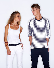 Image showing Fashion, confident and couple on a white background with trendy clothes, style and cool outfit. People, aesthetic and isolated man and woman dating in studio with confidence, attitude and pride
