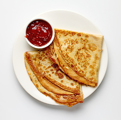 Image showing plate of crepes and strawberry jam