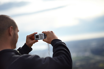 Image showing Man, camera and picture of nature for travel, photography and vacation memories, digital and sky. Male person, holiday and image of view, trip and adventure to explore, hike and inspiration or vision