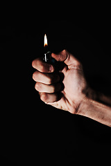 Image showing Hand, lighter and fire on black background, heat or warm element, ignite and glow with person in studio. Burning, flame and mockup space, fuel or gas with power, thermal and light, abstract and spark