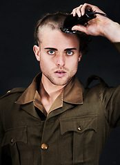 Image showing Military, soldier and portrait of man in haircut at studio isolated on a black background. Army, serious face and person shave hair with machine for grooming to prepare for service, bootcamp and war