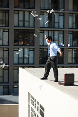 Image showing Business, financial freedom and money rain with a man in the city, throwing cash during a summer day. Finance, success or raining dollars with an employee on the roof of a building in an urban town