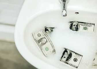 Image showing Bubble water, cash and money in a basin for deal, inflation or budget in a bathroom at home. Wealth, soap and dollar bills in foam in a sink for economic fraud or bankruptcy at modern house.