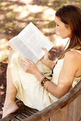 Image showing Woman, book and reading outdoors on holiday, peace and calm in nature for travel adventure in New York. Happy female person, freedom and break by tree, literature and fiction in park, story or novel