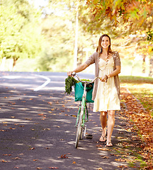 Image showing Bicycle, woman and walk for fitness in park, vacation portrait and eco friendly city with wellness and exercise. Norway, person and happy face in trendy fashion for summer, urban and sustainability