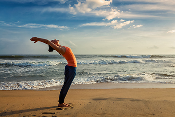 Image showing Woman doing yoga Sun salutation Surya Namaskar