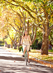 Image showing Bicycle, woman and happy for fitness in nature, vacation exercise and eco friendly central park with wellness. New york city, person and trendy fashion for summer, sustainability and urban travel