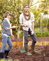 Image showing Portrait, man and woman for garden with agriculture in backyard with seeds, shovel and soil for nature. Happy people, couple or friends with smile for environment, sustainability and green in spring