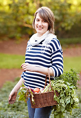 Image showing Harvest, basket and portrait of woman with vegetables from gardening in backyard. Happy, person and container with healthy produce, fruits or plants from farming agriculture or garden in countryside