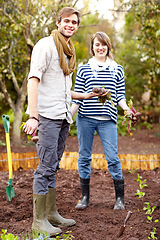 Image showing Portrait, man and woman for harvest in garden for fresh produce, vegetable and together. Happy couple, friends and smile for bond, love and care for sustainability in environment, nutrition and diet