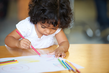 Image showing Young, girl or drawing at table in classroom for creative development, education growth in kindergarten. Child, daycare or pencils artwork for learning play in school or paper crayons, craft or color