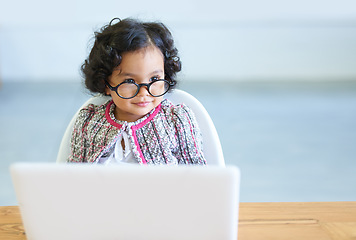 Image showing Young child, laptop and glasses at table for online learning education, development or growth. Female toddler person, internet or connection homework studying, virtual school or youth comedy dress up