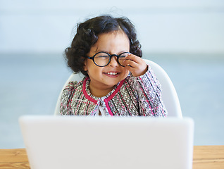 Image showing Little girl, dress up and laptop play business person fun, smile or laugh in fancy clothes. Toddler, glasses or office desk funny joke, childhood joy or cosplay for genius, amusement or performance