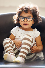 Image showing Toddler, girl and portrait or glasses for play, learning childhood development or education growth. Female person, kid or face eyewear on home relax sofa for intelligent, knowledge or nerd spectacles